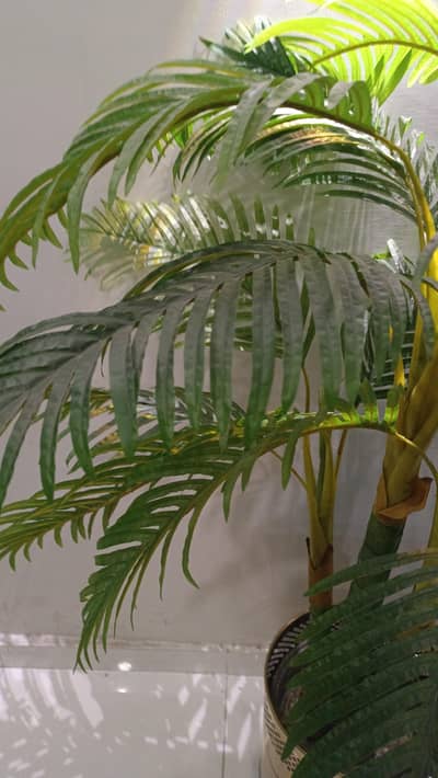 Artificial plant with steel bucket