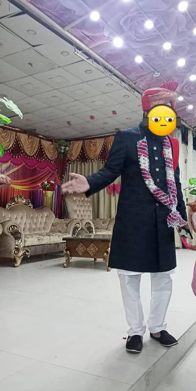 Black sherwani and red kulla with black Stylo shoes