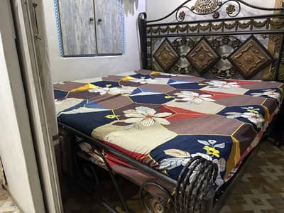King size bed with side table