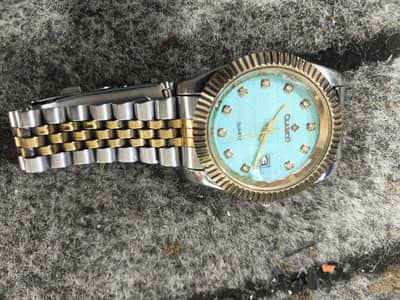 Clasico date adjust blue gold dial