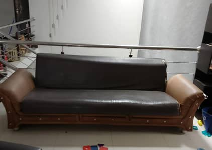 Sofa set including a sofa cum bed