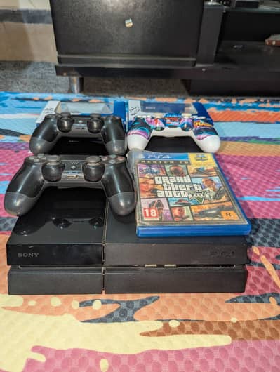 Playstation 4 with 3 controllers and GTA 5 CD for sell