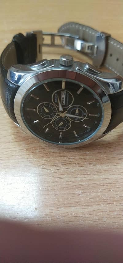 Tissot 1853 day date function dark glow light needles cndishn like new