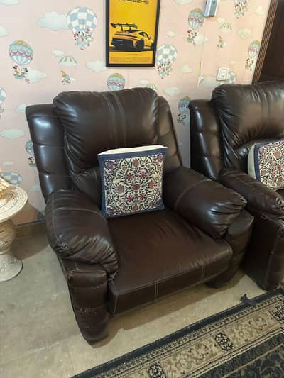 Brown leather sofa set with cushions