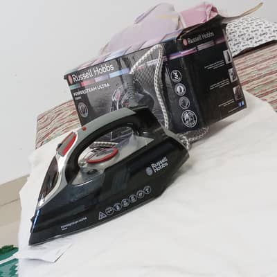 Brand new steam iron. 0323-6541651