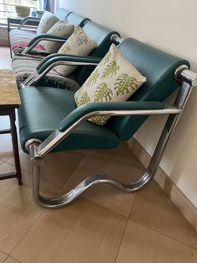 Four seater sofa with stainless steel frame