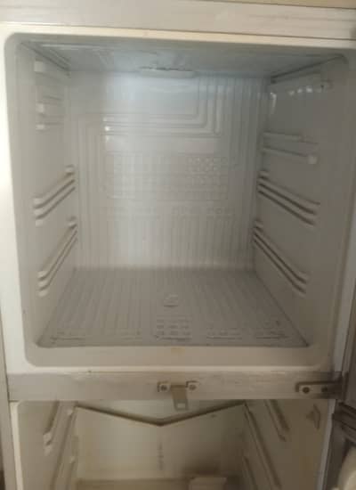 It's a creme colored refrigerator.