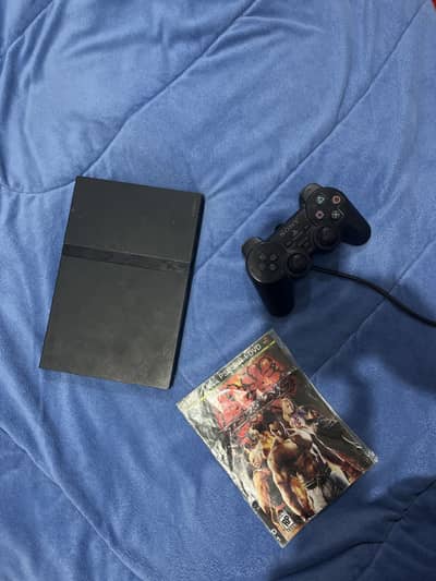 PlayStation2 with one controller all cables and a free game