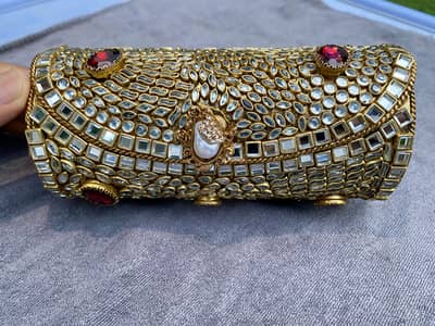 Kundan Clutch – Antique Gold with Maroon & Silver Stones