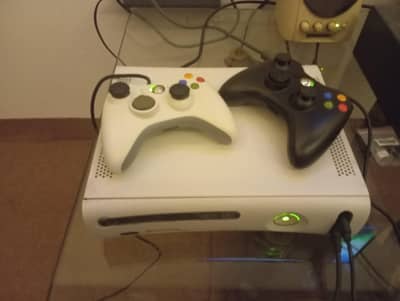 Xbox 360 having more than 80 games and 2 controllers