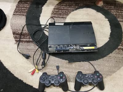 play station 3 super slim with two original controllers (without games