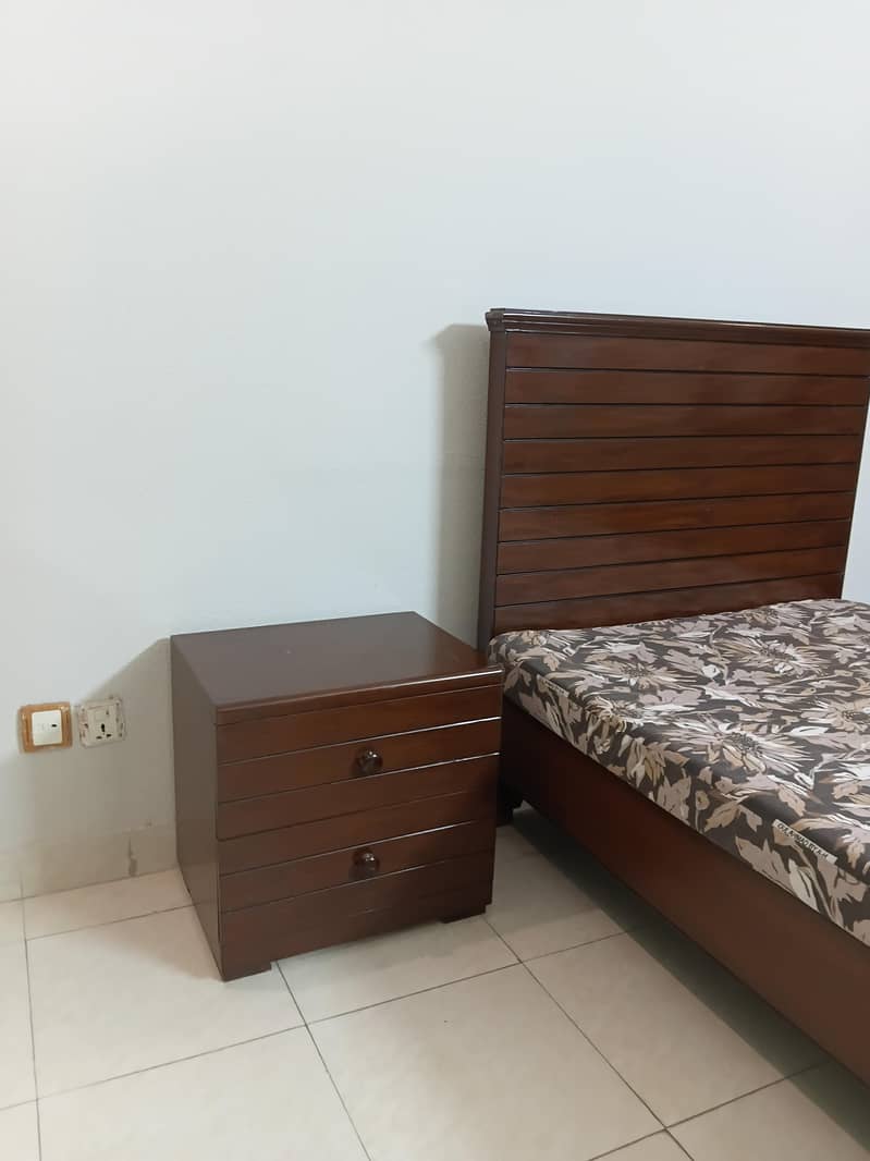 single bed with side table 0