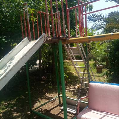 swing with slide made with heavy iron good condition