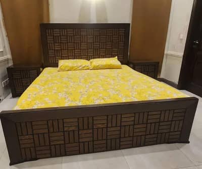 king size wooden bed with side tables