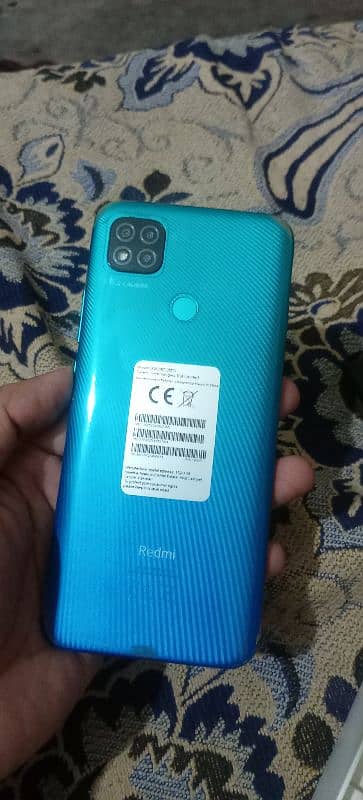 Redmi 9c 128/6 with charger condition like new.