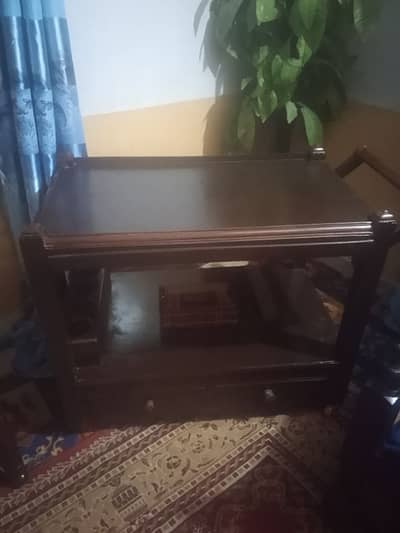 two wood chairs and tea trolley