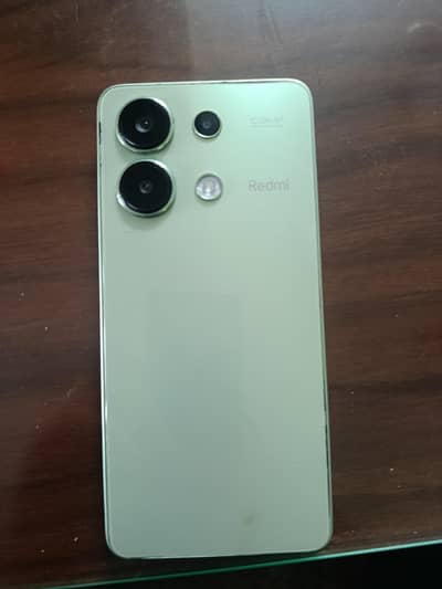 Xiaomi Redmi Note 13. lime green color.