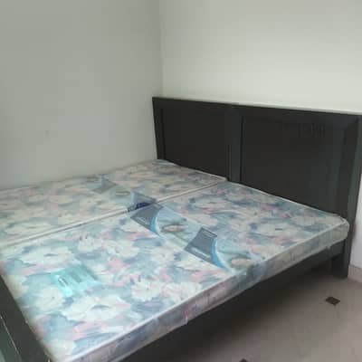 Two single beds with mattress