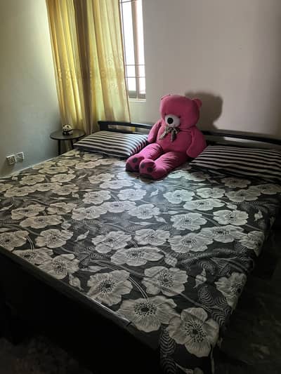 2 single wooden bed