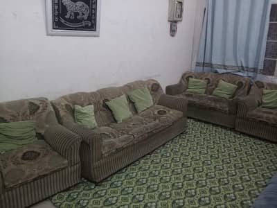 7 seater sofa se in pista green color with 7 cushions