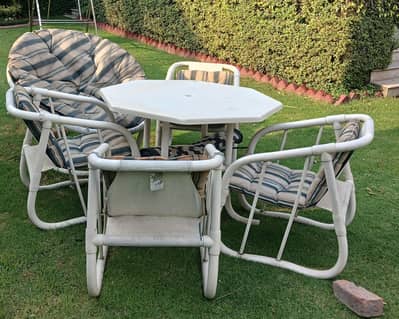 outdoor company. 4 chairs one Lounge and one  table