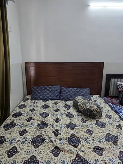 king sized wooden bed