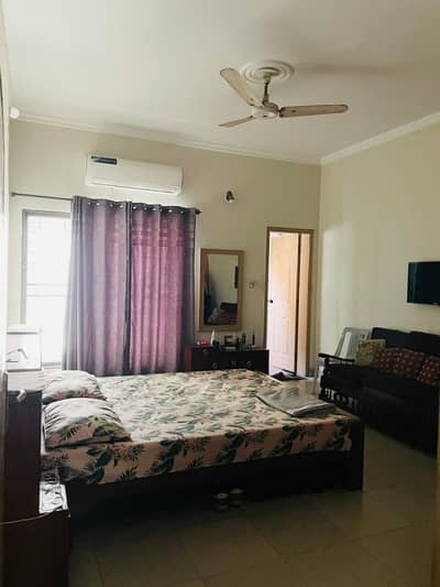 12 Marla Upper Portion for Rent in A2 Block Johar Town Lahore Facing Park Near Boulevard, Expo Center, Emporium Mall, schools, hospitals, and restaurants.