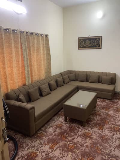 8seater Lshaped sofa along with centre table and twopufys is availible