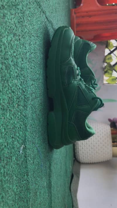 Green sports shoes