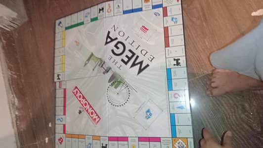 one mega edition monopoly and one small edition monopoly with