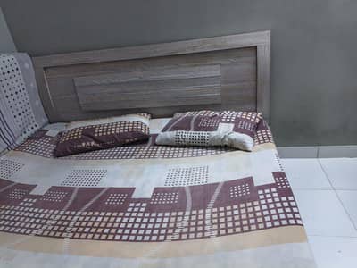 Bed and Cupboard