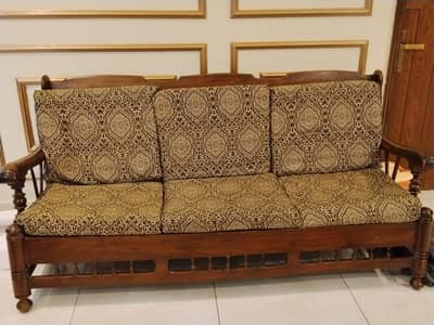 5 seater wooden sofa with 5 cushions and 2 sets of covers