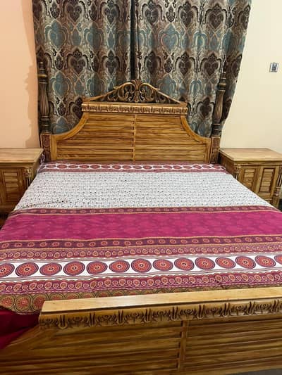 bed with two side tables and dressing