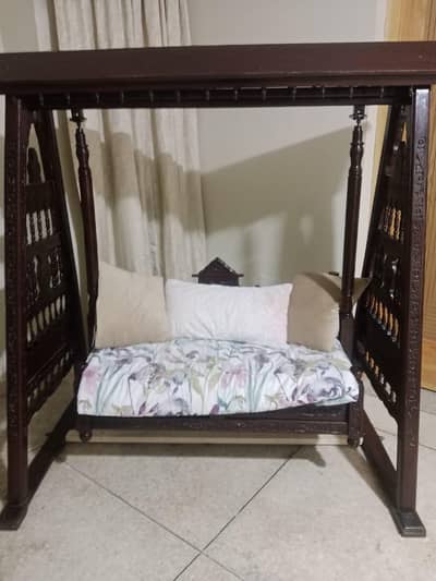 Pure wooden  2 seater swing curving on it 8/10 condition