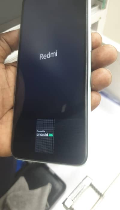 redmi mobile saf pic bas penal k niche halka Nishan he toota ni he