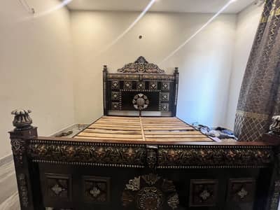 Bed without side table and wardrobe