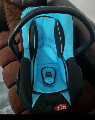 Slightly used car seat, colour black & blue.