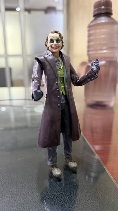branded action figure of anime and DC