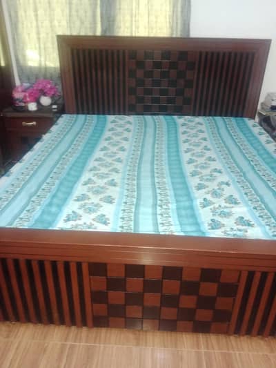 bed with side tables and dressing table