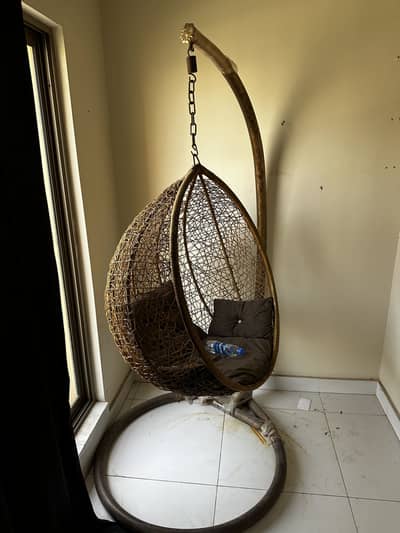 Hanging chair with a stand