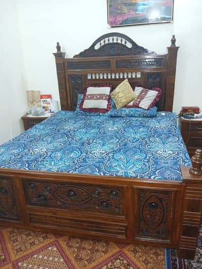 Bed Set with a wardrobe and room chairs.