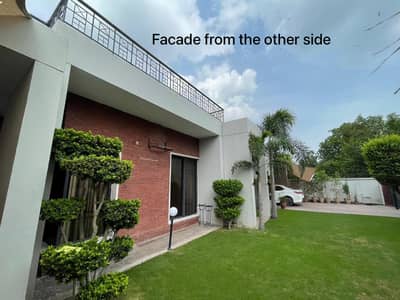 SYED BROTHERS PROUDLY OFFERS: 2-Kanal Elegant Duplex Double Unit Bungalow Is Available In The Best Block Of DHA Lahore.