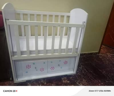 Wooden baby cot with drawers in good condition