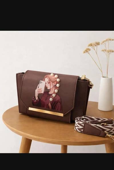 Brown printed leather wo'mens hand  bag with adjustable strap