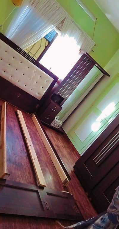 king size bed with dresser and cupboard