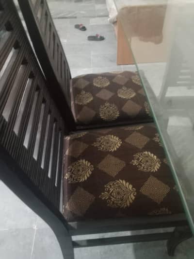 Dinning table Glass top with stylish 6 wood chair for sale
