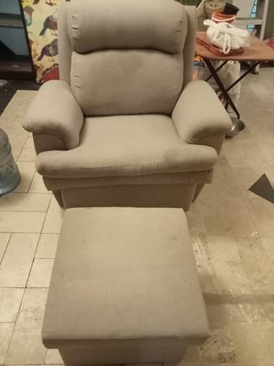 Single arm chair with foot stool