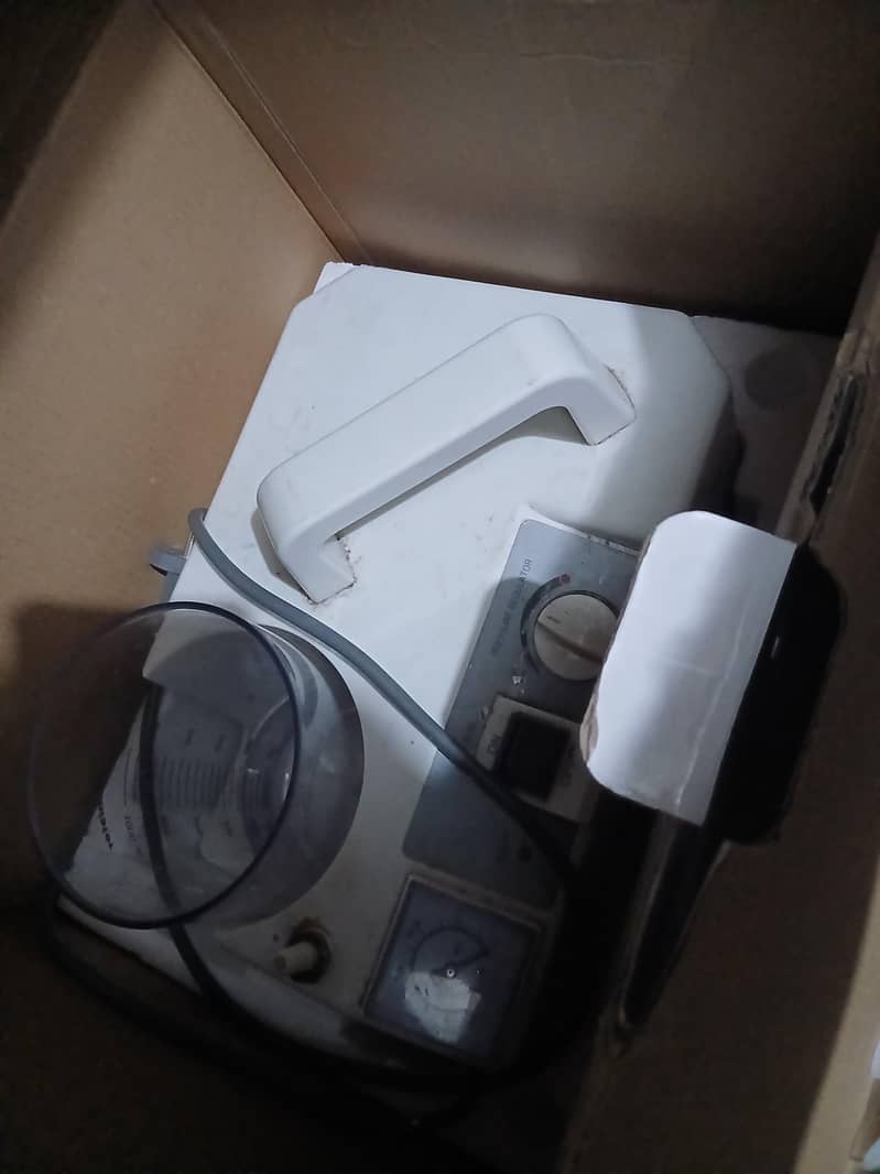 suctioning machine 1