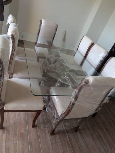 Solid wood dining table with glass top