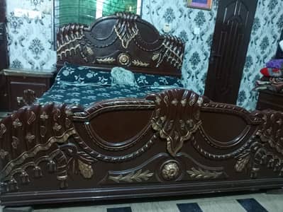 Wooden bed with dressing table and with sidetable